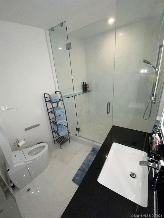 bathroom with tile flooring, toilet, a shower with shower door, and sink