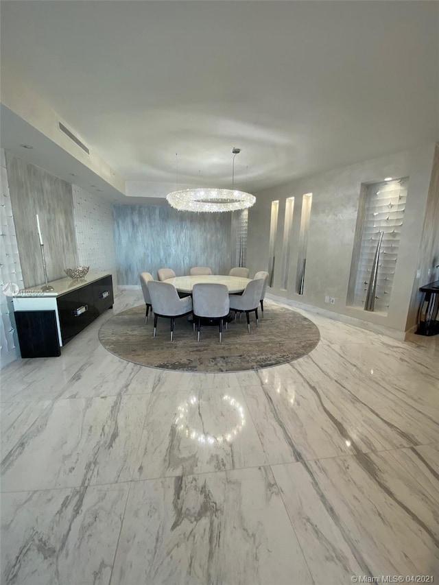 unfurnished dining area with an inviting chandelier and light tile floors