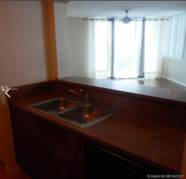 kitchen with black dishwasher and sink