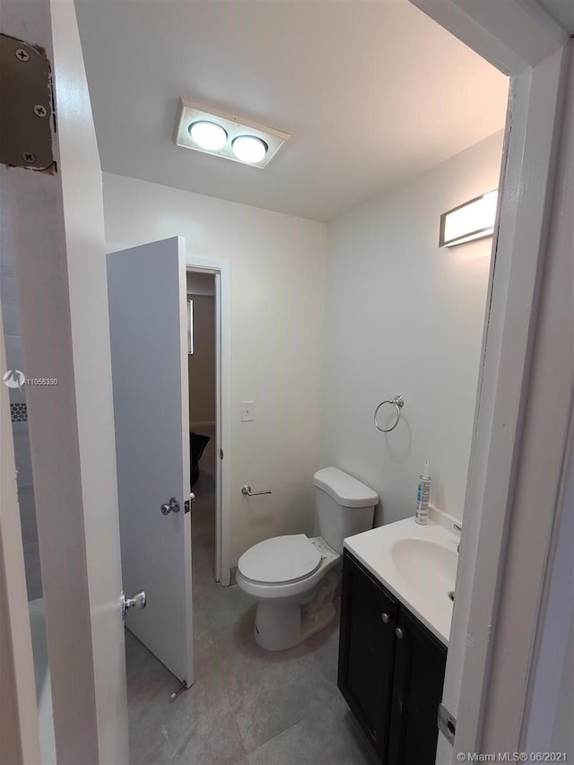 bathroom with vanity and toilet