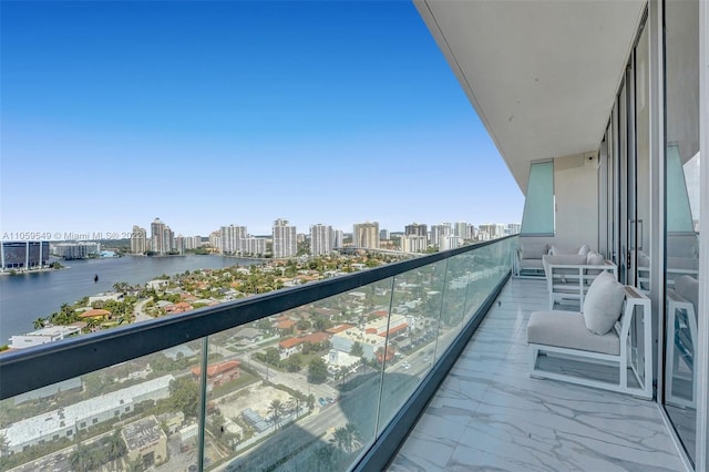 balcony with central AC unit and a water view