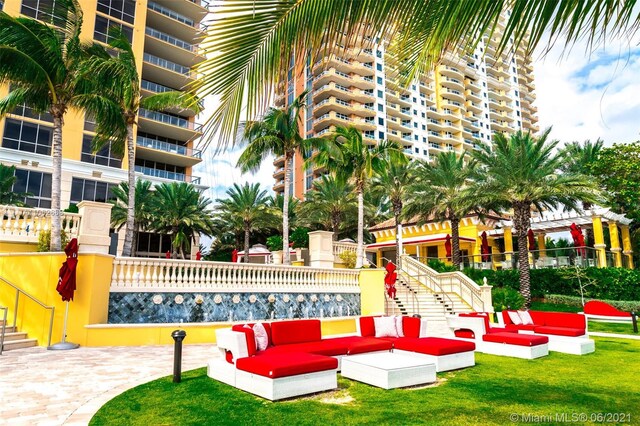 view of home's community with a yard and outdoor lounge area