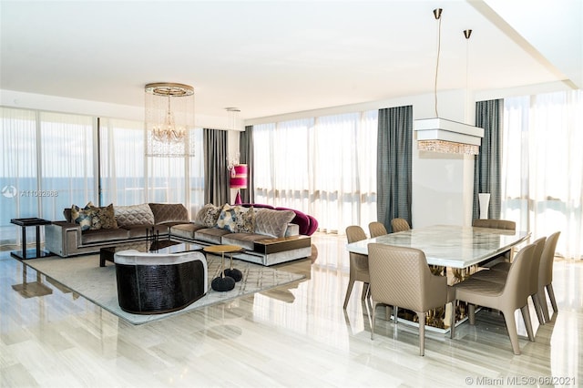 dining room featuring light hardwood / wood-style flooring and a notable chandelier