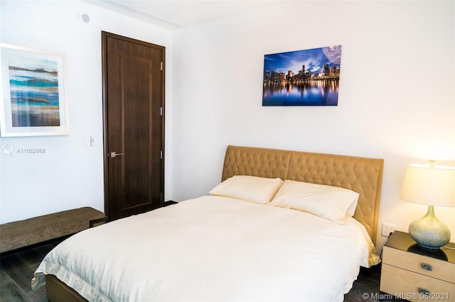 bedroom featuring dark hardwood / wood-style floors