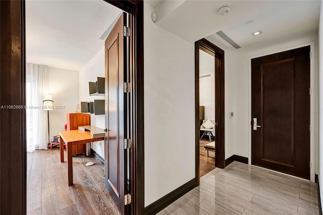 corridor featuring wood-type flooring