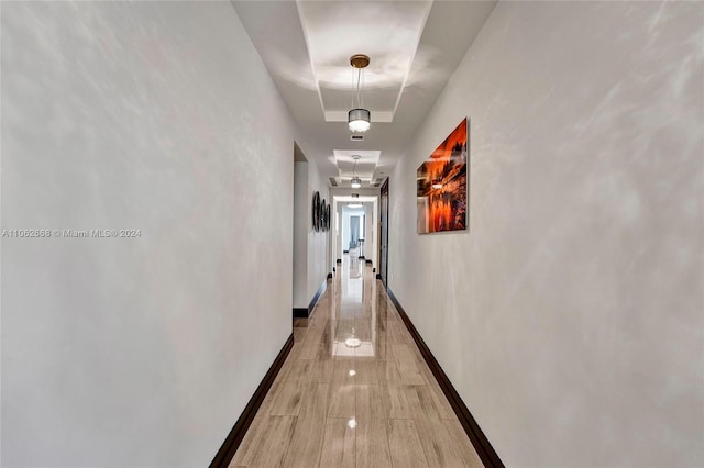 corridor with hardwood / wood-style floors