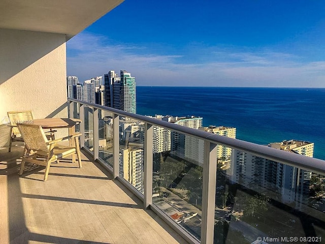 balcony featuring a water view