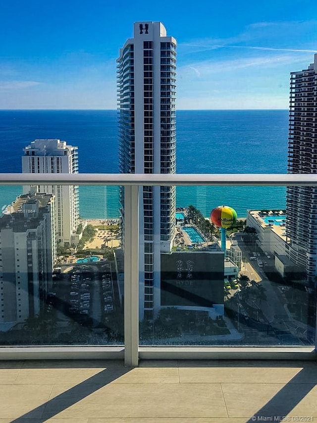 balcony featuring a water view