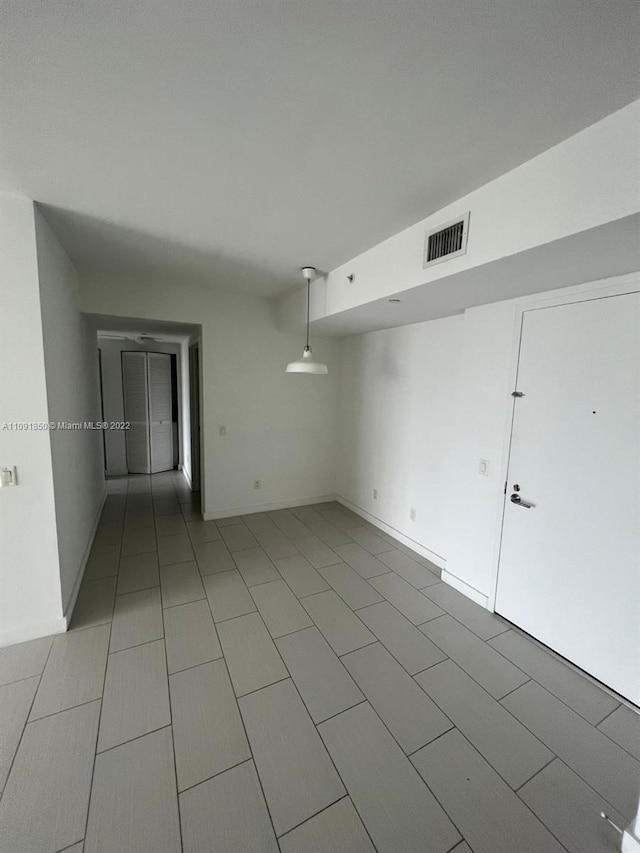 empty room featuring light tile floors