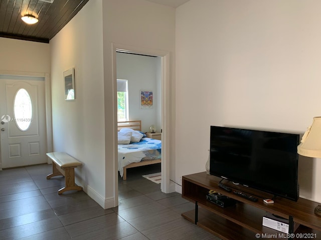 tiled entrance foyer with wooden ceiling