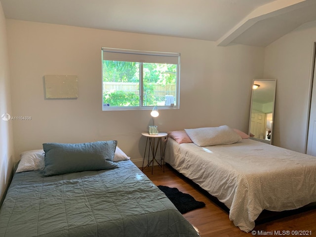 bedroom featuring dark hardwood / wood-style flooring