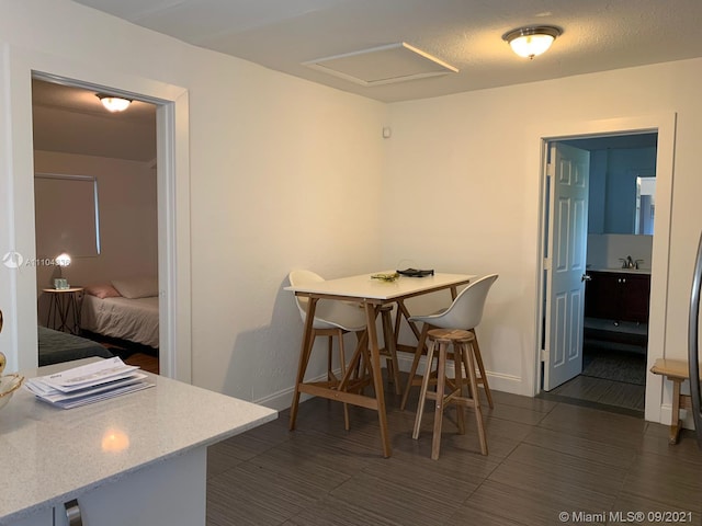 dining area with dark tile floors