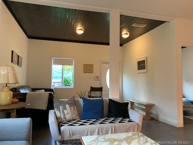 tiled living room featuring wood ceiling