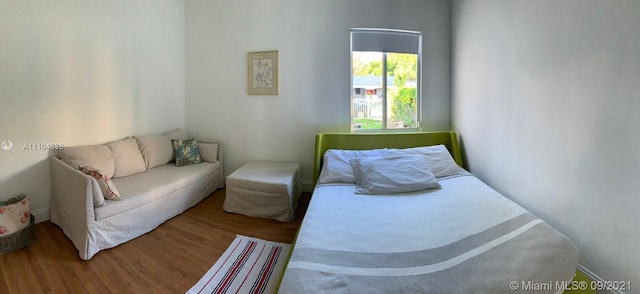 bedroom with wood-type flooring