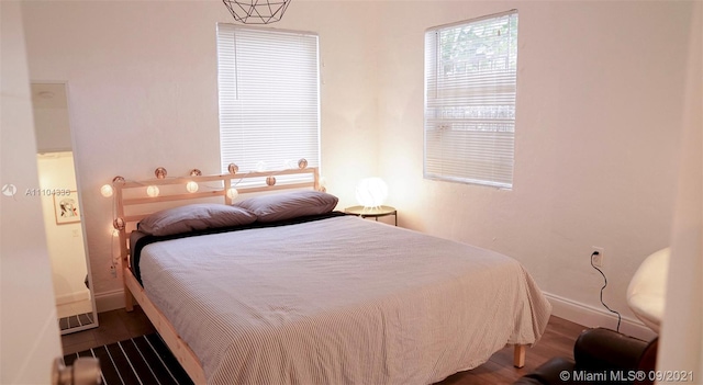 bedroom featuring dark wood-type flooring