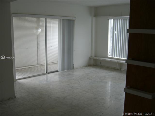 spare room with tile floors