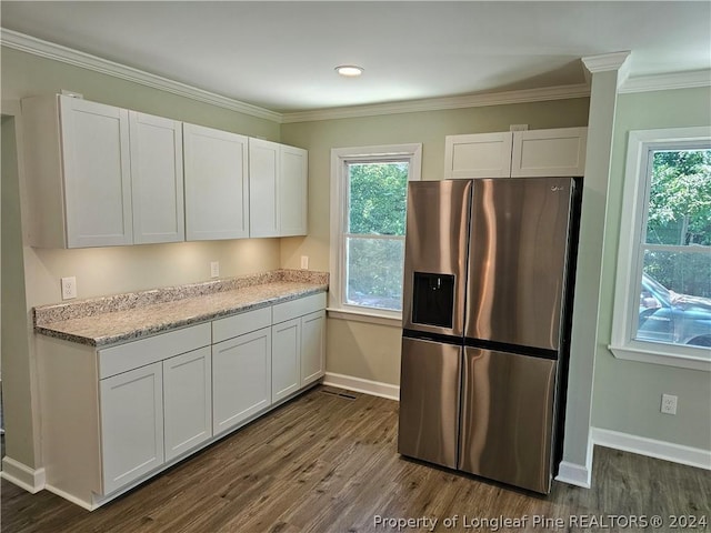 kitchen with white cabinetry, stainless steel fridge with ice dispenser, dark wood-type flooring, and ornamental molding