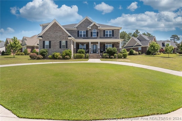 craftsman-style house featuring a front yard and a porch