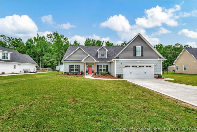 craftsman-style house with central AC unit, a garage, and a front yard