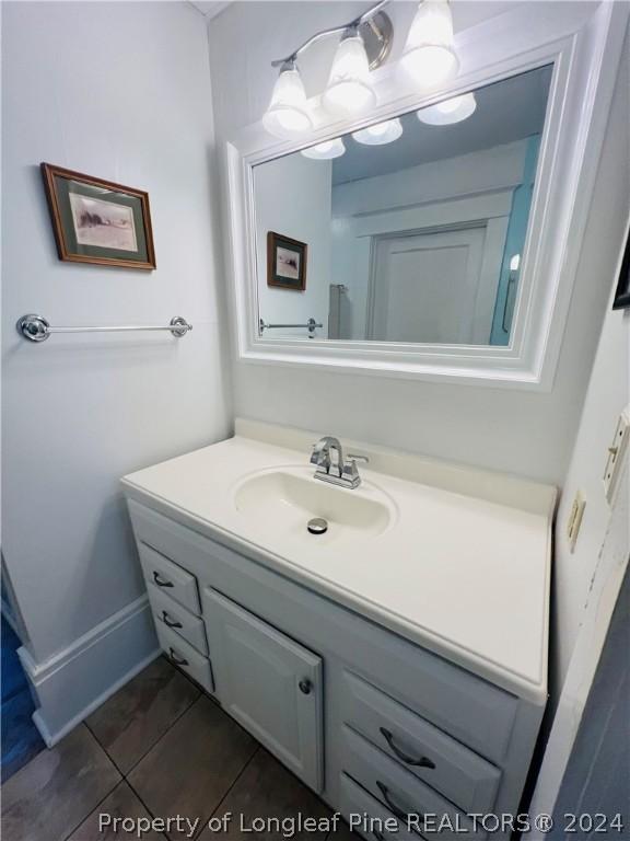 bathroom featuring tile patterned floors and vanity