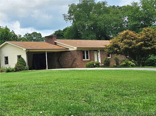 ranch-style home with a front yard