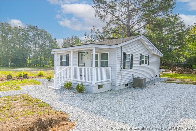 manufactured / mobile home featuring a porch and central AC unit