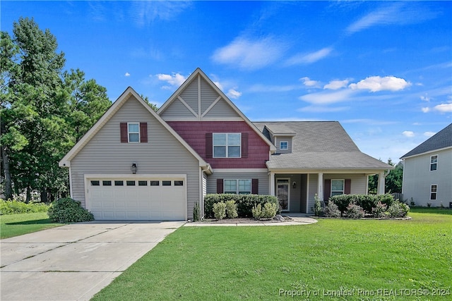 view of front of home featuring a garage and a front yard