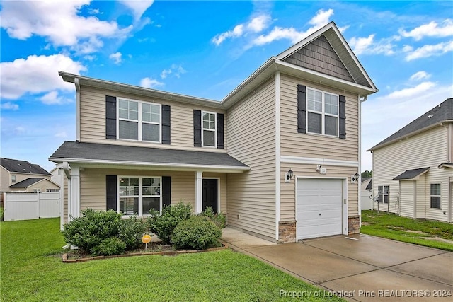 front of property with a porch, a garage, and a front lawn