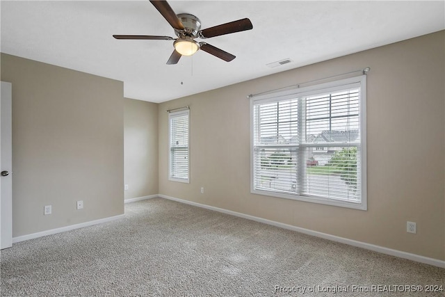 carpeted empty room with ceiling fan