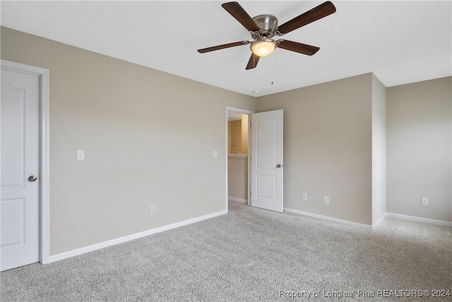 unfurnished bedroom with light colored carpet and ceiling fan