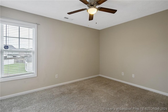 unfurnished room with carpet floors and ceiling fan