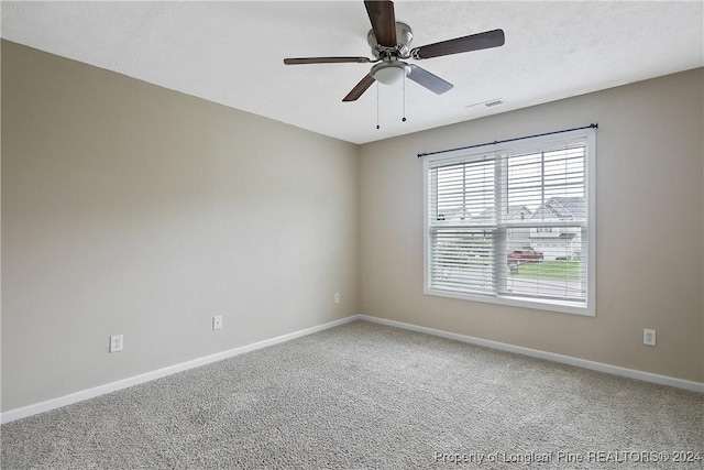 unfurnished room with carpet floors, a textured ceiling, and ceiling fan