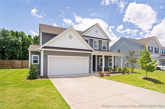 view of front of house with a garage and a front yard