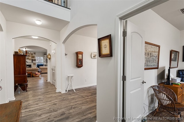 corridor featuring wood-type flooring