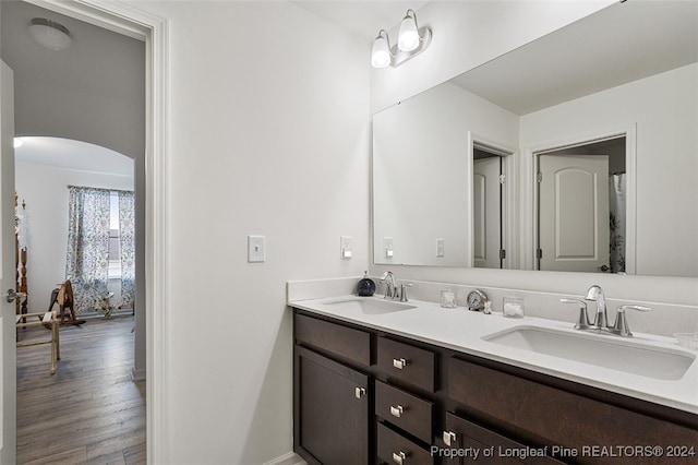 bathroom featuring hardwood / wood-style flooring and vanity