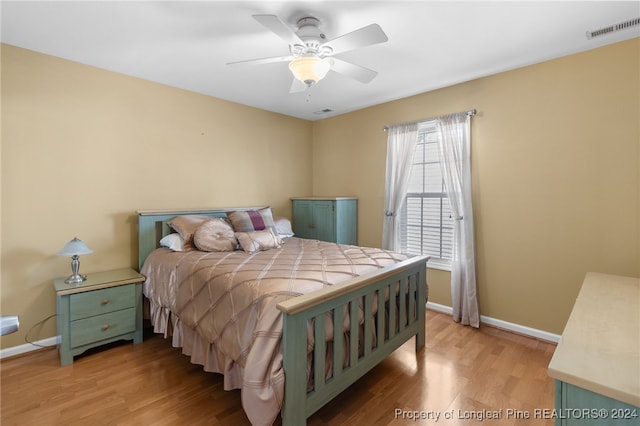 bedroom featuring ceiling fan and light hardwood / wood-style flooring