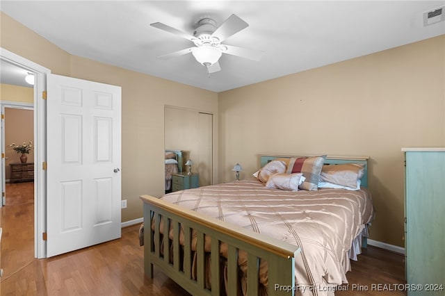 bedroom with ceiling fan and light hardwood / wood-style floors