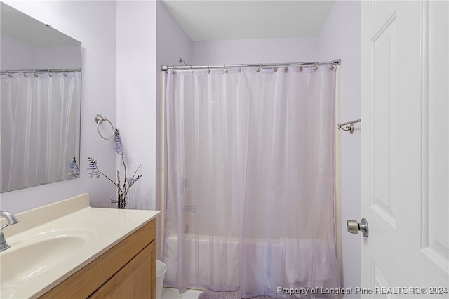 full bathroom featuring vanity, toilet, and shower / bath combination with curtain