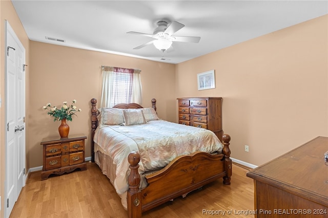 bedroom featuring light wood-type flooring and ceiling fan