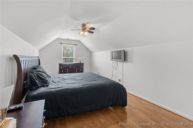 bedroom with lofted ceiling, wood-type flooring, and ceiling fan