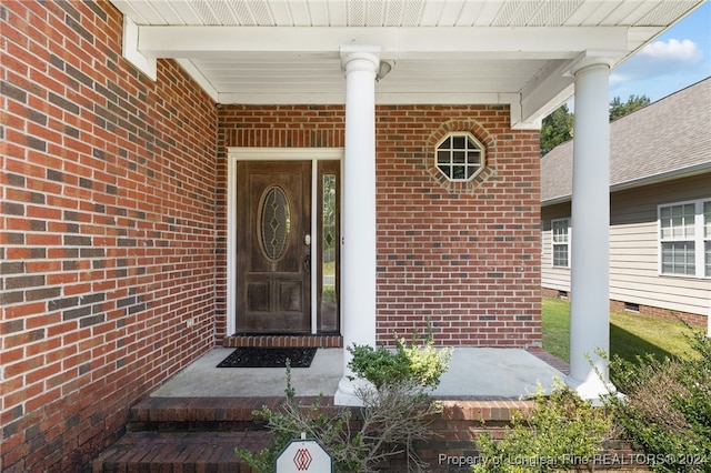 doorway to property with a porch