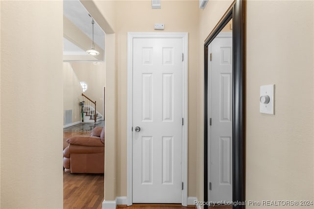 corridor featuring hardwood / wood-style floors