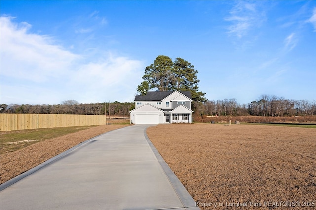 view of front of home with a garage and a front lawn