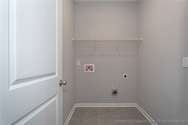 laundry area featuring hookup for a washing machine, hookup for an electric dryer, and tile patterned floors