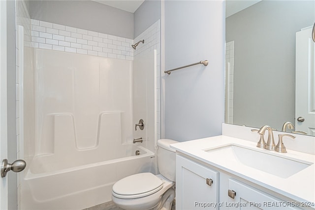 full bathroom featuring vanity, toilet, and washtub / shower combination