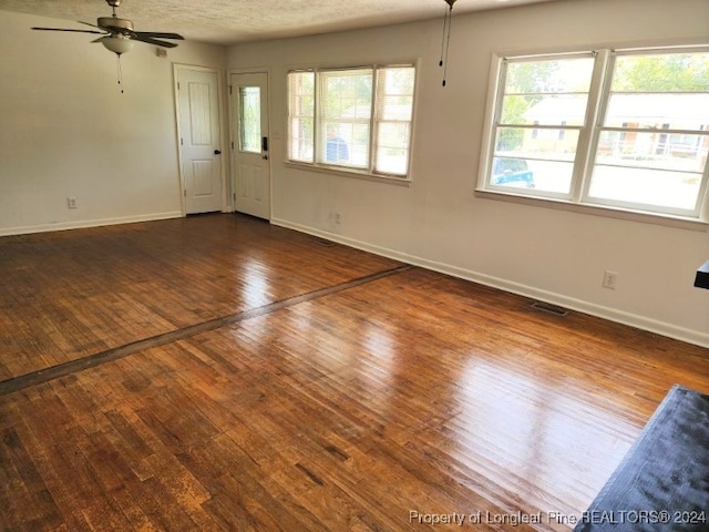 interior space with hardwood / wood-style floors and ceiling fan