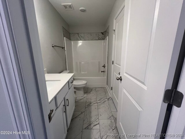 full bathroom featuring vanity, toilet, and tub / shower combination