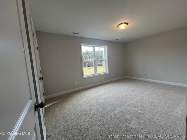 empty room with carpet flooring