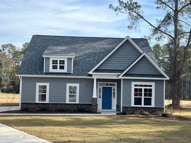 craftsman-style home with a front lawn