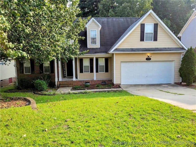 view of front facade featuring a garage and a front lawn